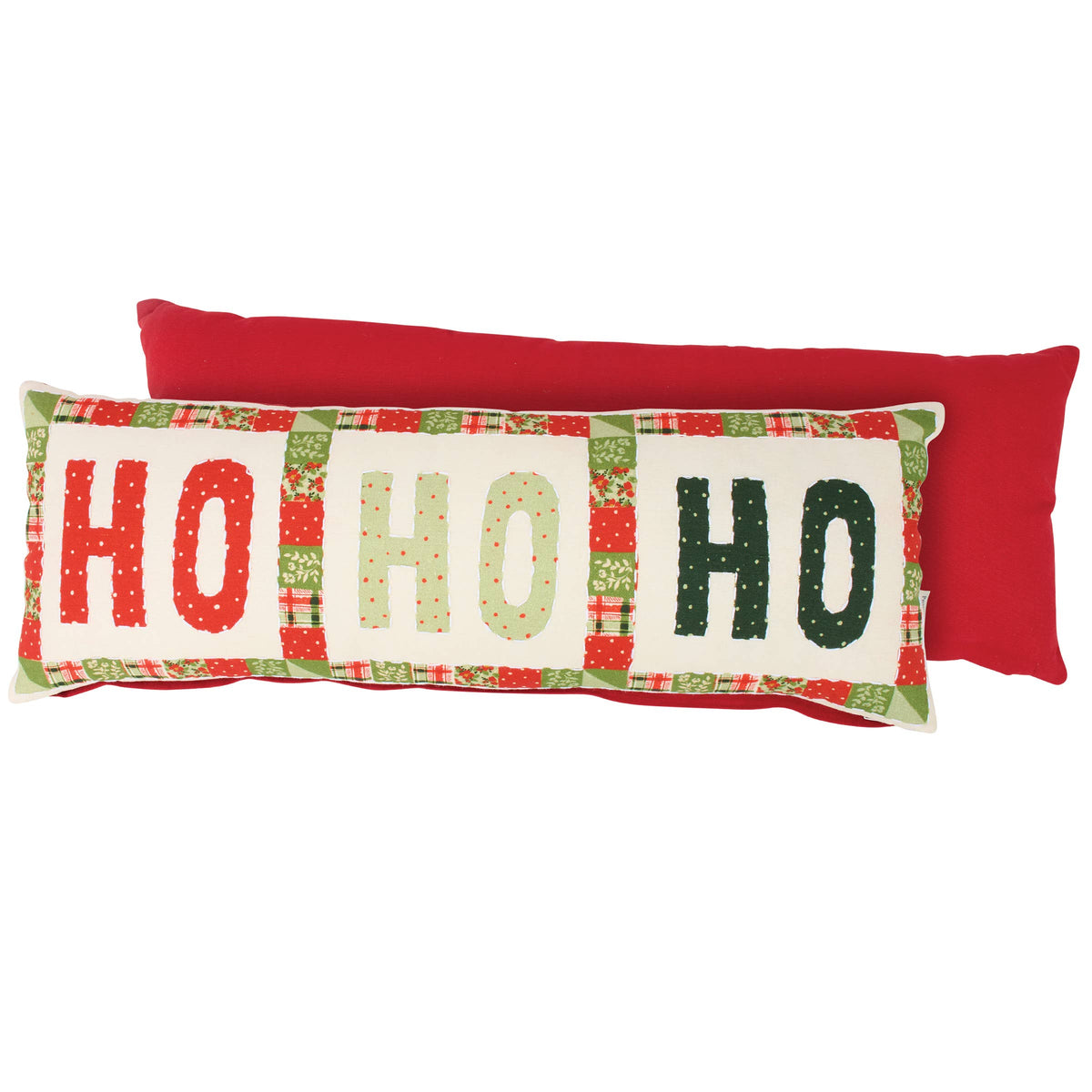A rectangular Christmas lumbar pillow with 'HO HO HO' lettering in red, green, and beige patterns on an off-white background, layered over a solid red lumbar pillow, set against a plain white background.