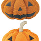 Two sets of plush pumpkins with smiling faces on a white background