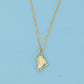 Gold ice skate pendant necklace on a blue card with a light blue background